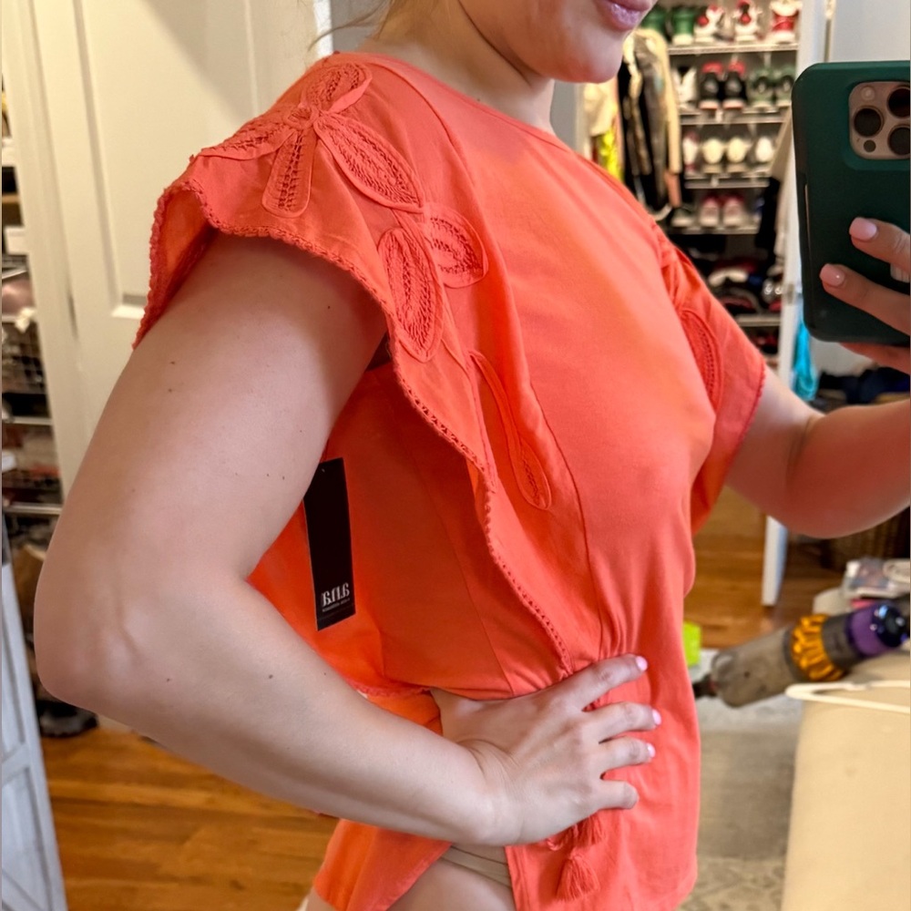 Orange or “hot coral” sinch waist blouse
